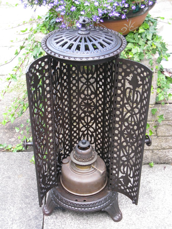 pierced cast iron cylindrical paraffin room heater